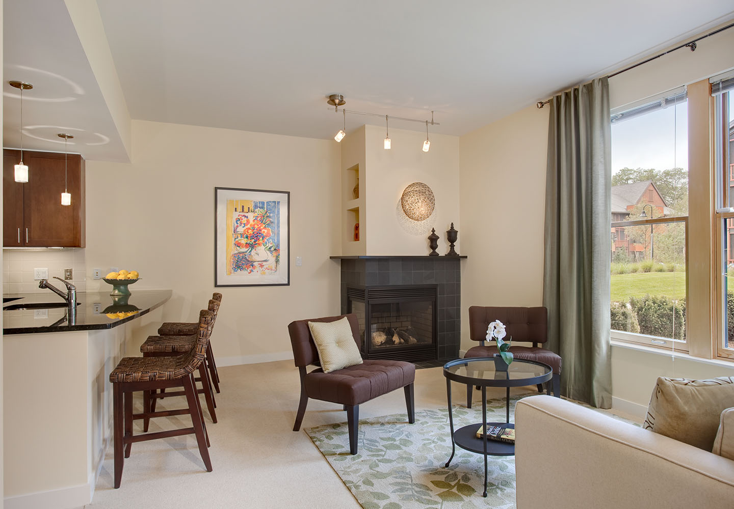 Interior of Villa apartment showing an open floorplan and a big window.