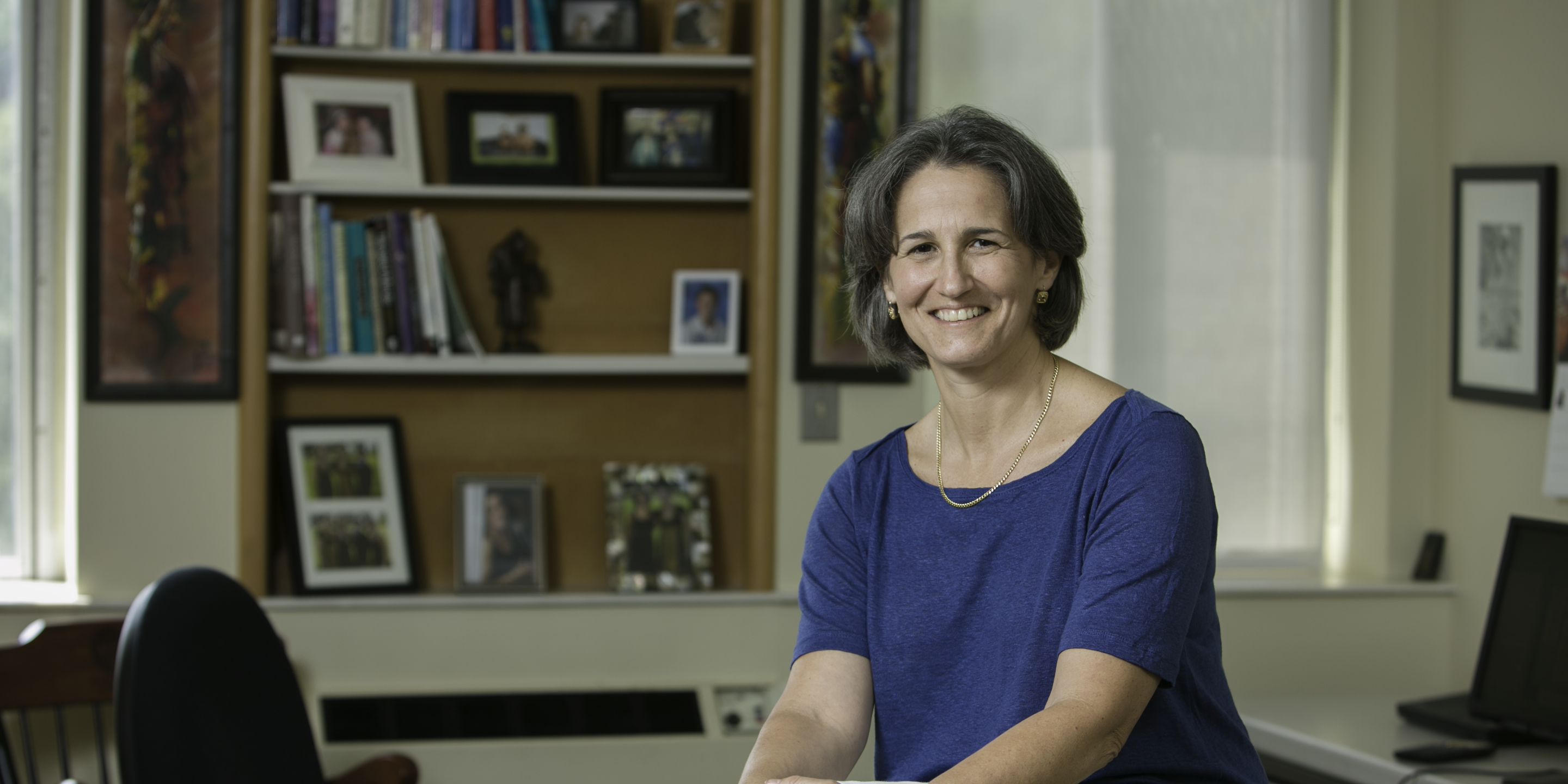 Susan Mitchell sits in her office