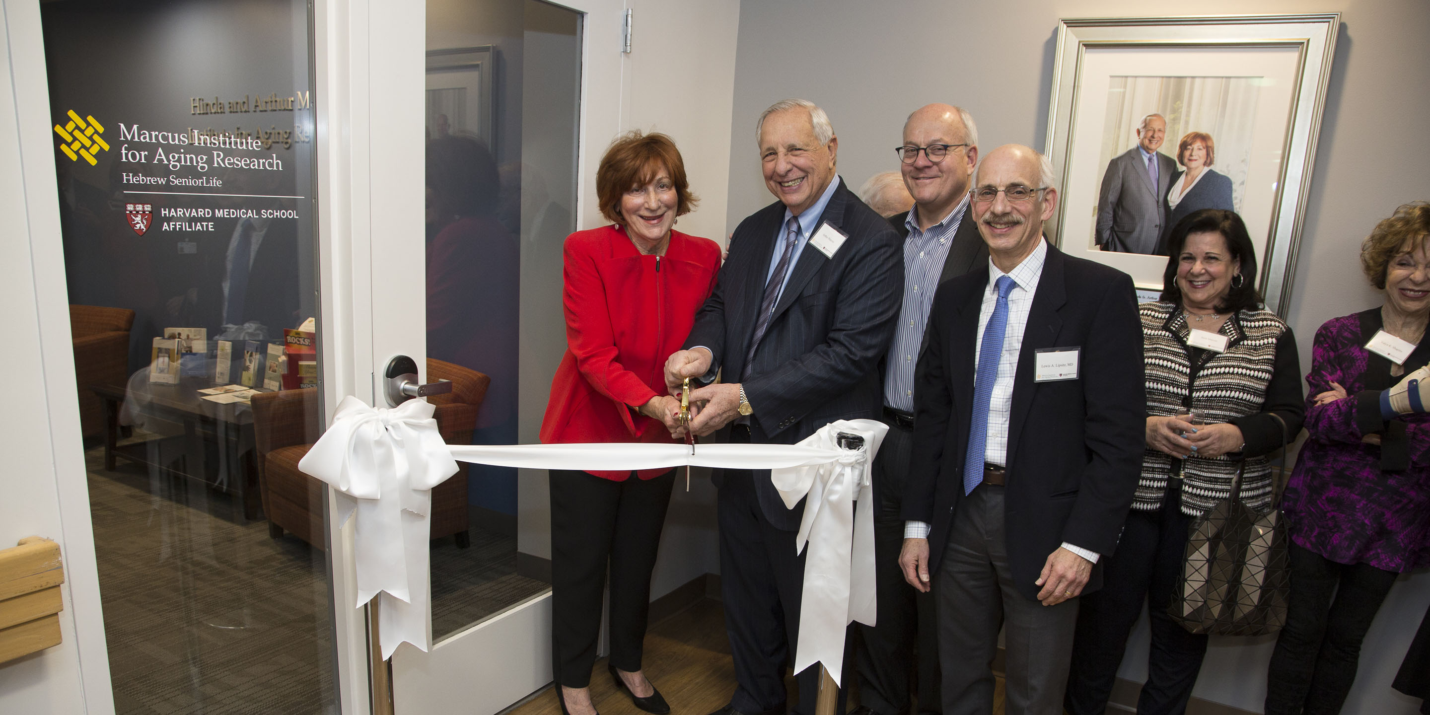 People gather at a ribbon-cutting at the Marcus Institute for Aging Research 
