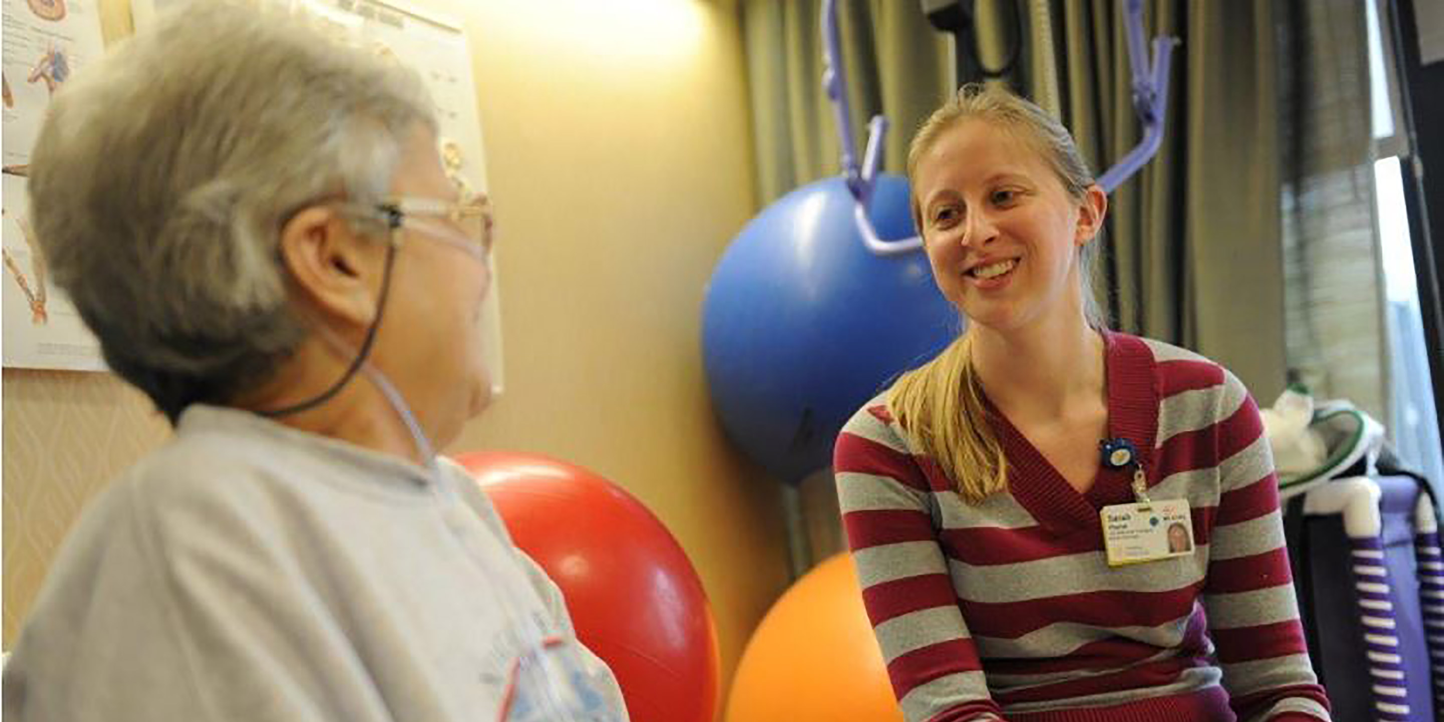 A patient meets with a therapist during a rehabilitation session with staff at Hebrew Rehabilitation Center.