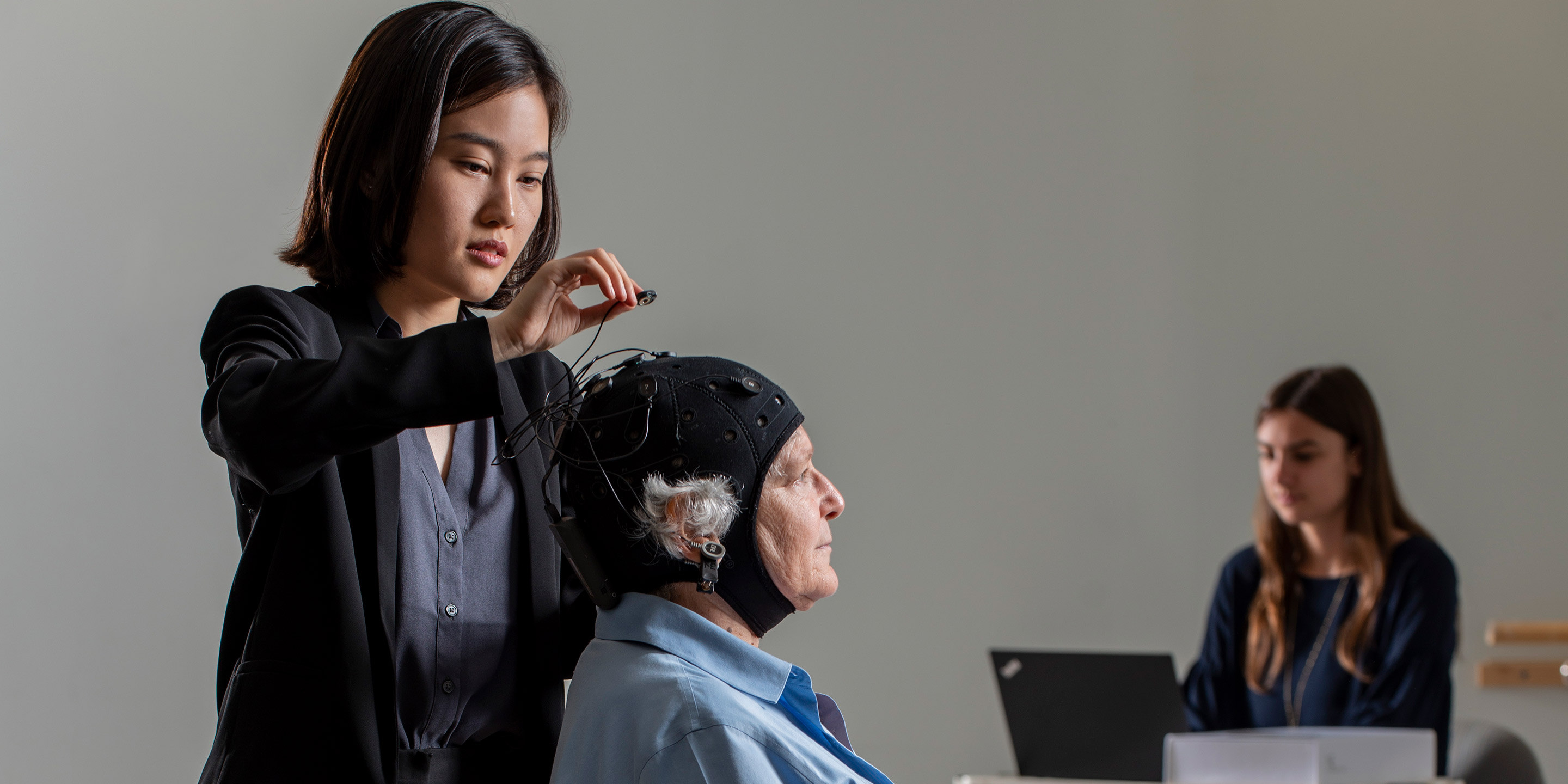 An elder woman participates in Marcus Institute research by getting her brain stimulated 