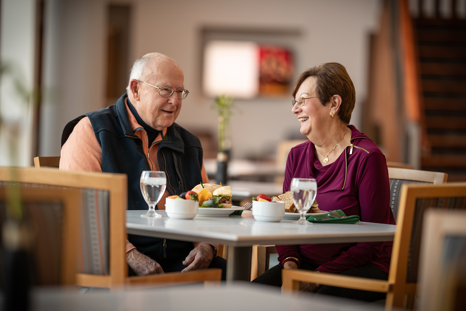 A couple sits and enjoys a meal together.