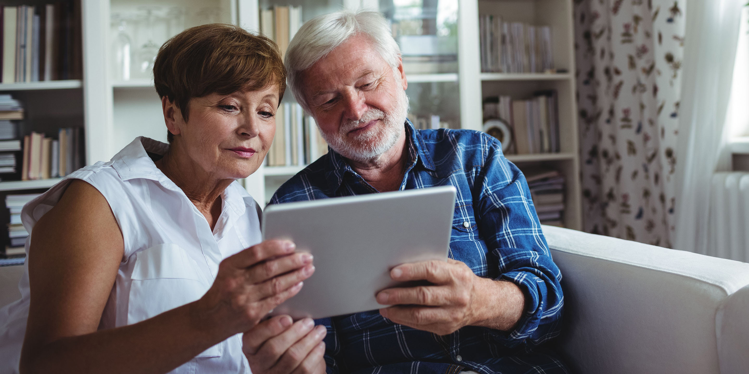 Woman sitting with senior man