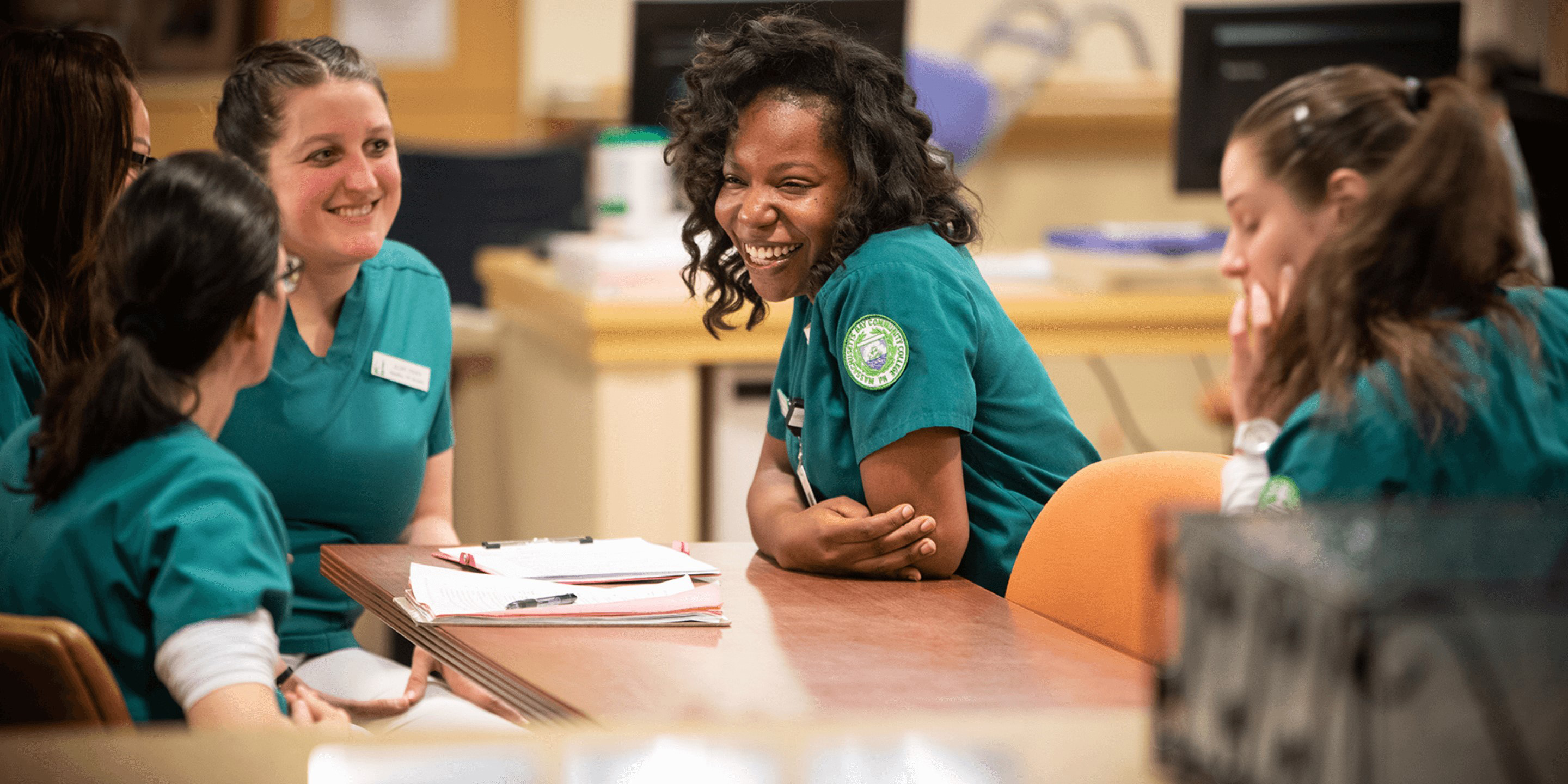 nurses sitting at a table