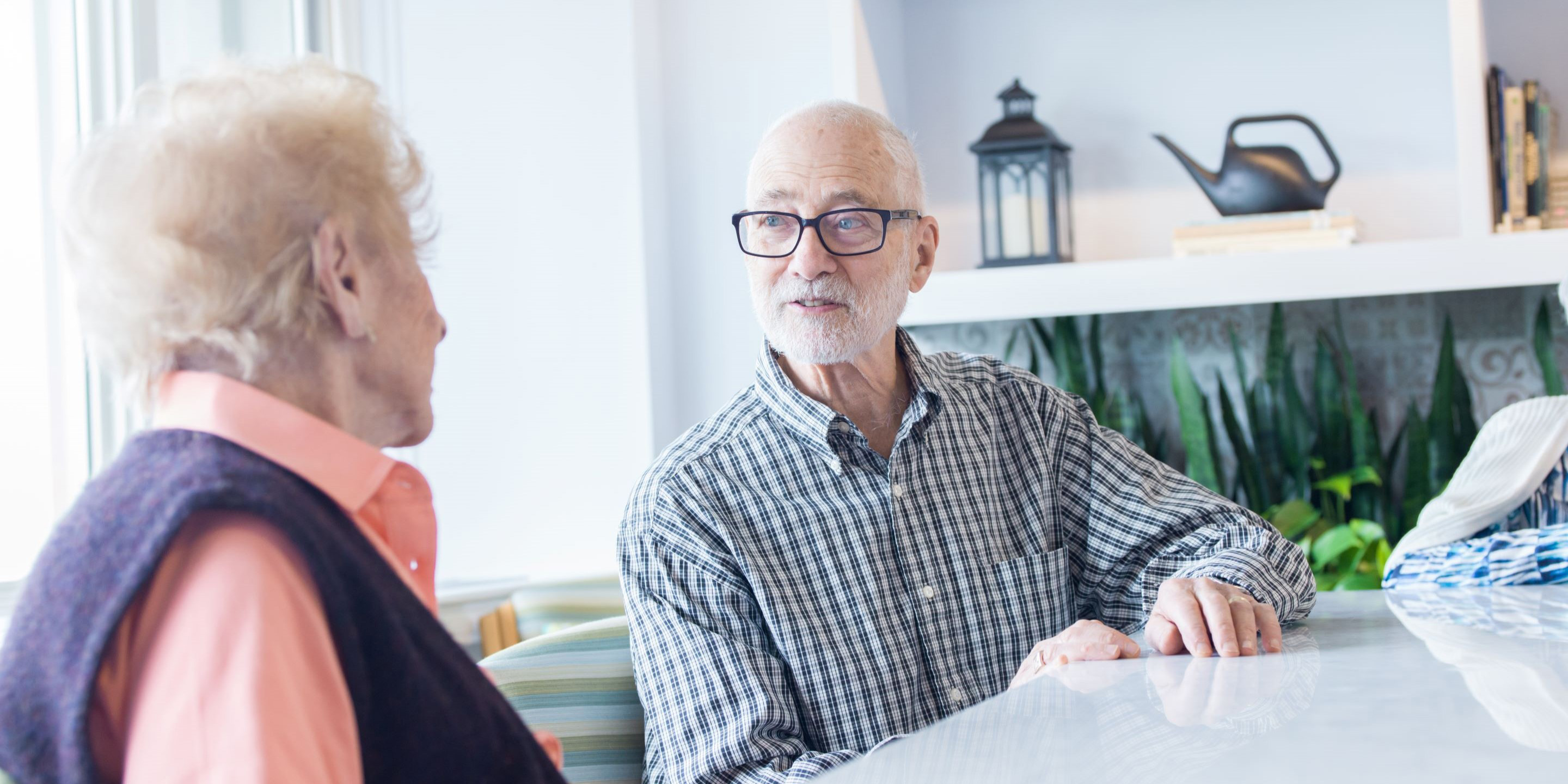 Man sitting with senior woman