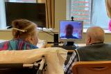 A senior couples skypes with a family member during the COVID-19 pandemic.
