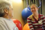 A patient meets with a therapist during a rehabilitation session with staff at Hebrew Rehabilitation Center. 