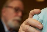 Rabbi Joel Barron comforts someone who is receiving hospice care 