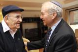 Two men shake each other's hands 