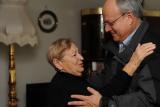 Hebrew SeniorLife's CEO Lou Woolf goes in for a hug with a female senior 