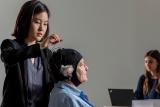 An elder woman participates in Marcus Institute research by getting her brain stimulated 