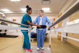 Woman Nurse with Woman Patient