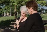 woman sitting with grieving friend