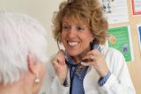 Woman doctor smiling at patient