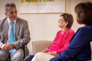 Dr. Pascual-Leone sitting with patient