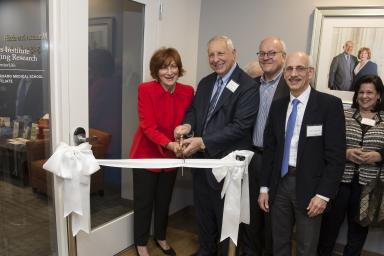 People gather at a ribbon-cutting at the Marcus Institute for Aging Research 
