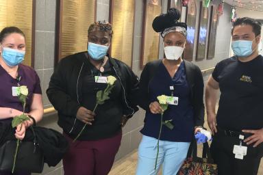 HRC Roslindale Security Team delivered flowers to staff during COVID-19.