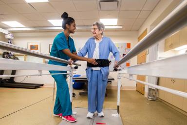 Woman Nurse with Woman Patient