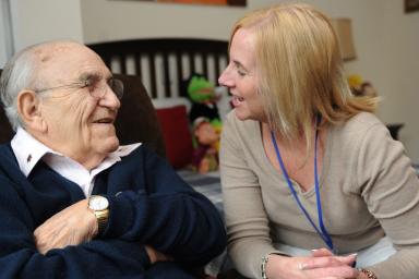 woman sitting with senior man