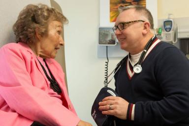Woman sitting with doctor