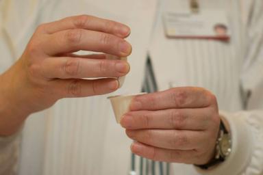 Male doctor setting up antisychotic medication