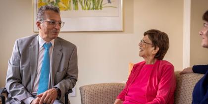 Doctor sitting with woman