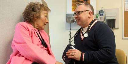 Woman sitting with doctor