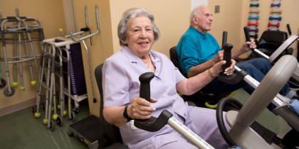 Older woman and man doing exercises