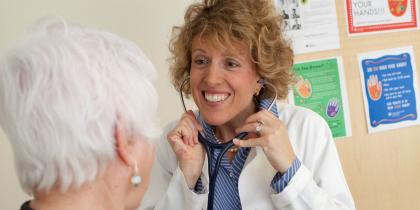 Woman doctor smiling at patient