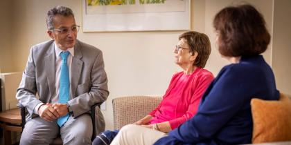 Dr. Pascual-Leone sitting with patient