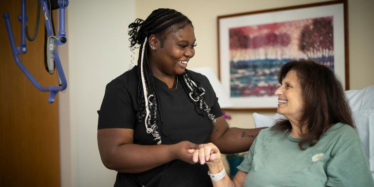 Nurse standing next to patient