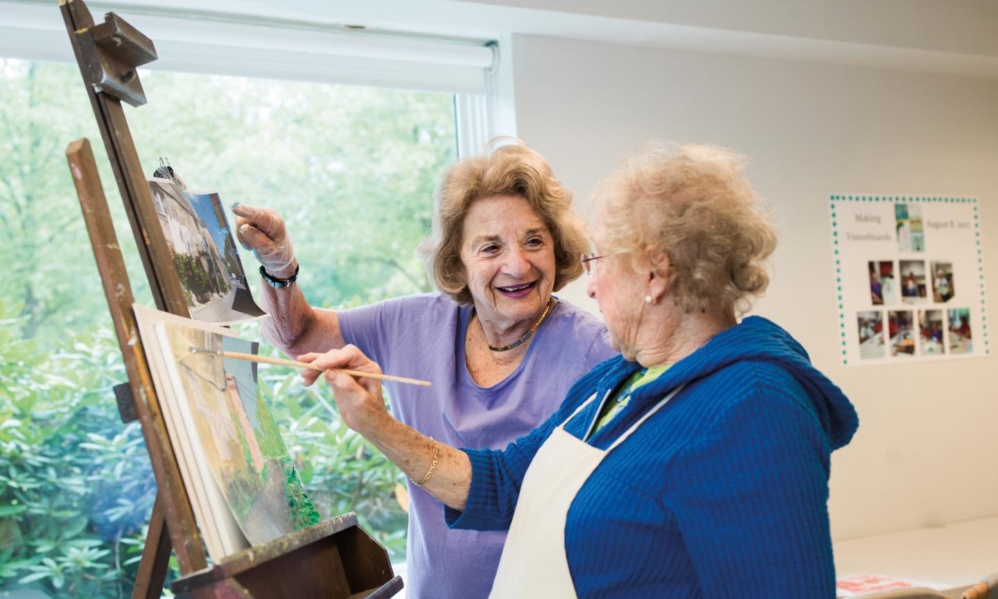 Two women painting.