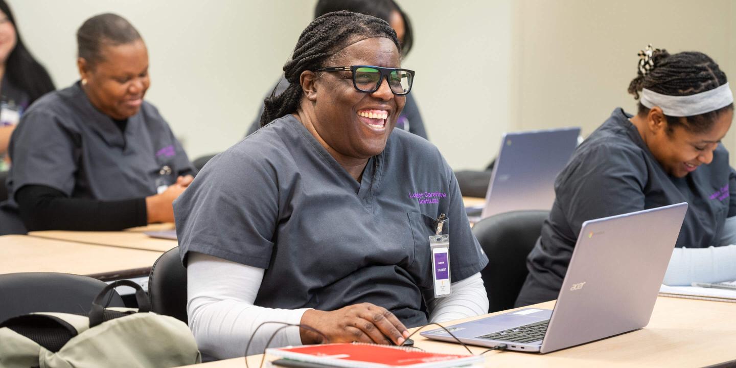 Student smiling in classroom