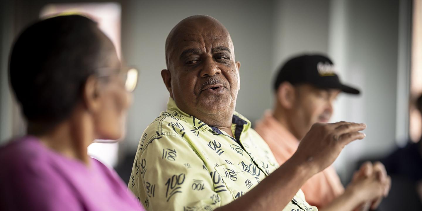 Older residents participating in a discussion group.