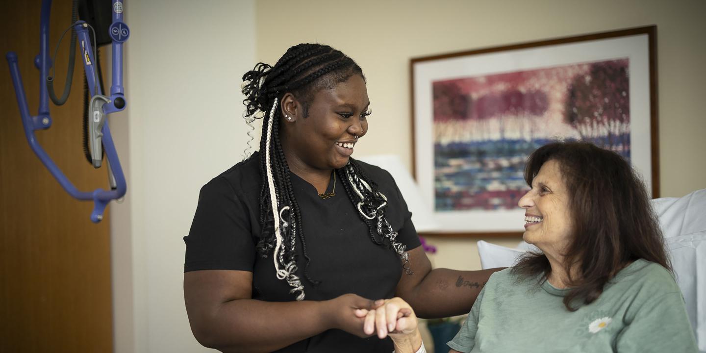 Nurse standing next to patient