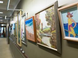 Between the lobby and library of Orchard Cove lies a rotating gallery of resident art.