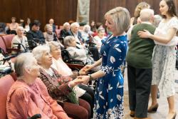 Staff dance with patients at a Russian-speaking program event.