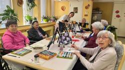 Patients participating in a painting event