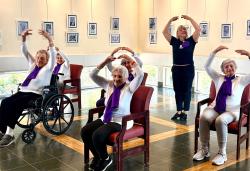 Patients doing dances from their chairs