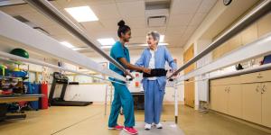 Nurse standing with patient