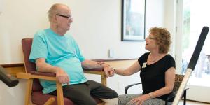 Staff member sitting with patient 