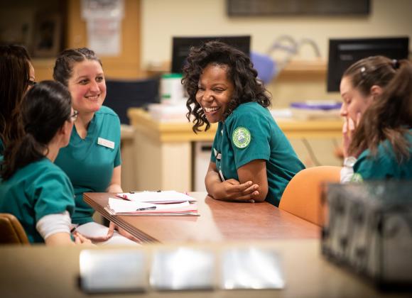 A group of nursing school students enjoy a break during on-site training.