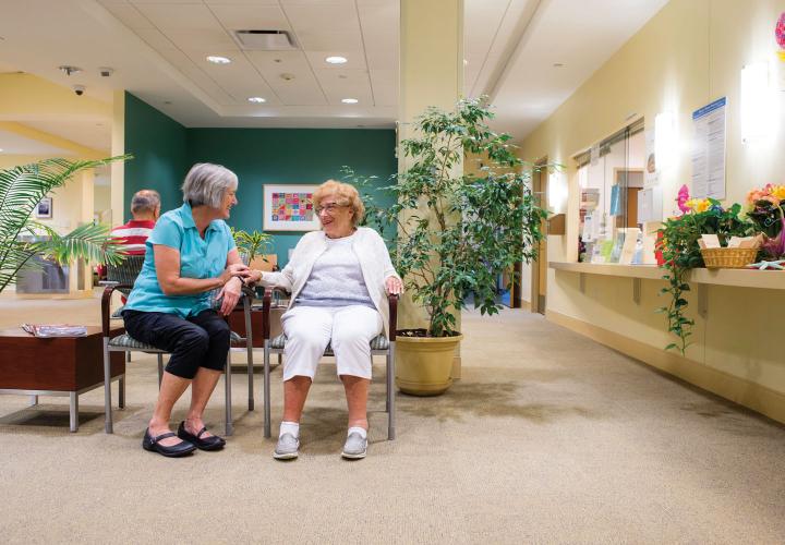 A NewBridge resident waits to see her Harvard Medical School-affiliated geriatrician at our on-site medical practice.