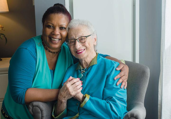 Woman hugging an older woman